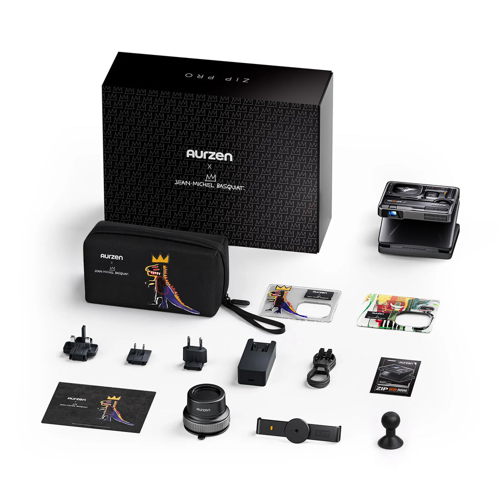 Portable projector kit with case, accessories, power adapters, lens cleaning cloth, and documents