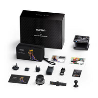Portable projector kit with case, accessories, power adapters, lens cleaning cloth, and documents