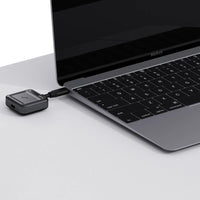Aurzen CastPlay Pro USB-C wireless adapter connected to a MacBook for screen casting