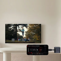 Aurzen CastPlay Pro USB-C wireless adapter streaming video wirelessly from a smartphone